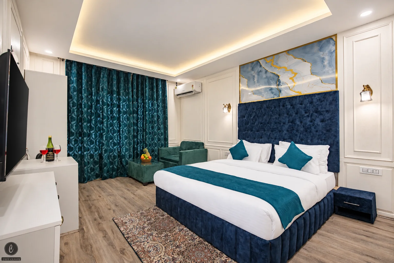 Deluxe room without balcony at Classy Castle by Nasmu Stays, with teal bedding and pale panelled walls