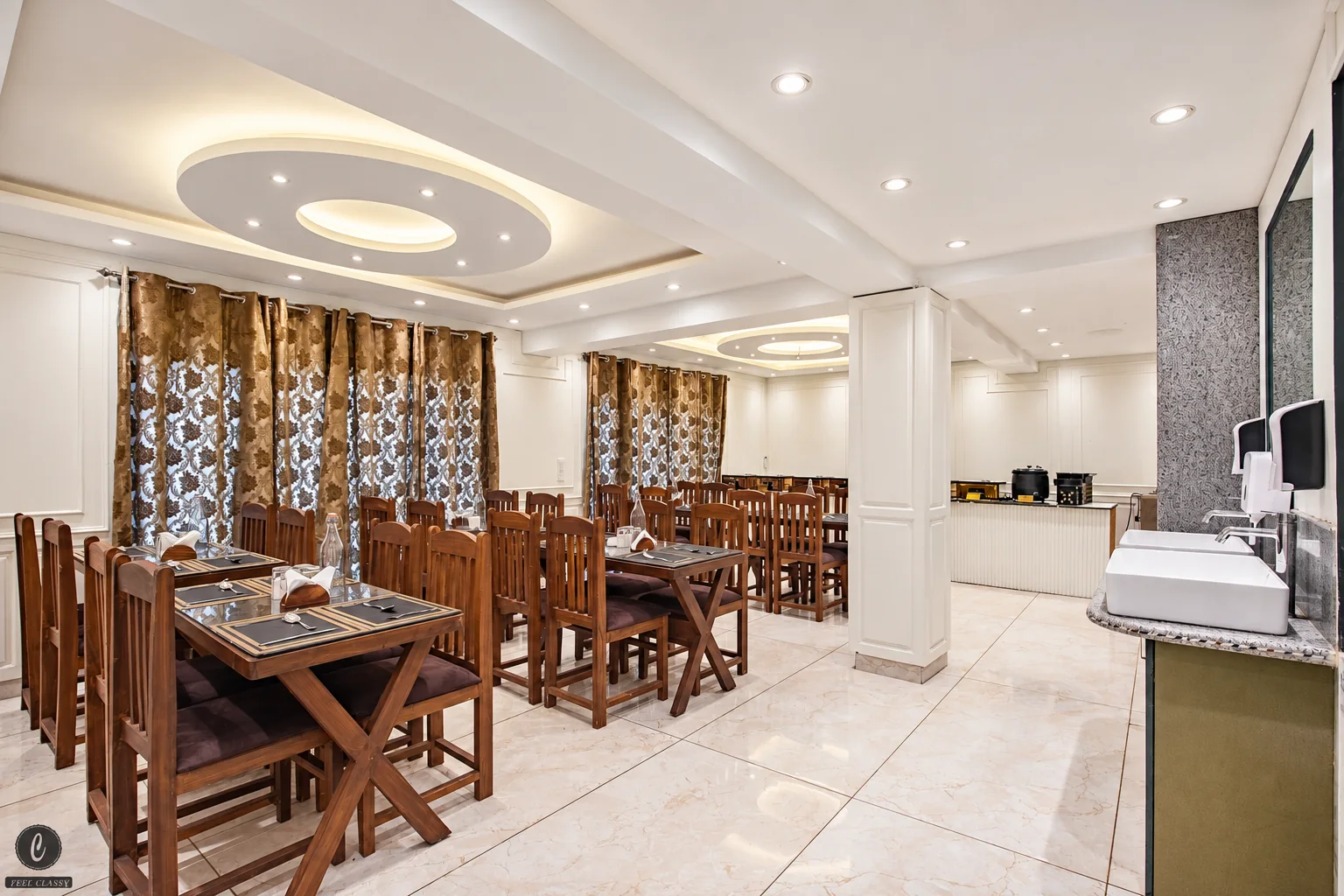Classy Castle by Nasmu Stays dining room with wooden tables, chairs and a serving counter