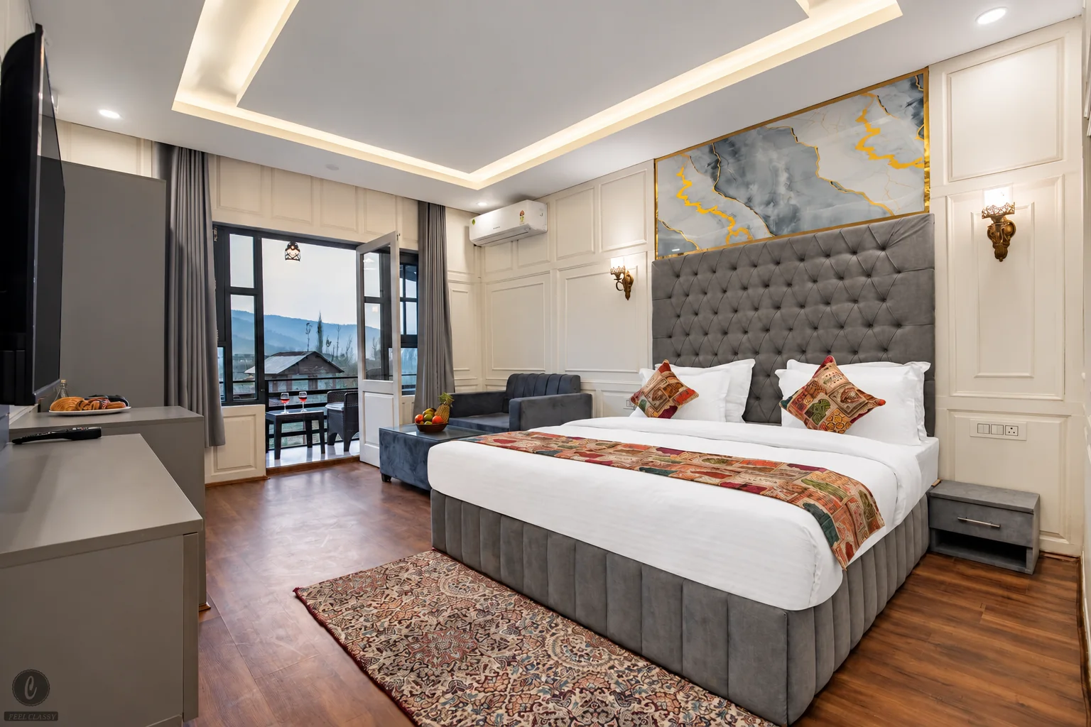 Premium room at Classy Castle Pahalgam by Nasmu Stays with an upholstered bed, pale wall panels and a balcony doorway